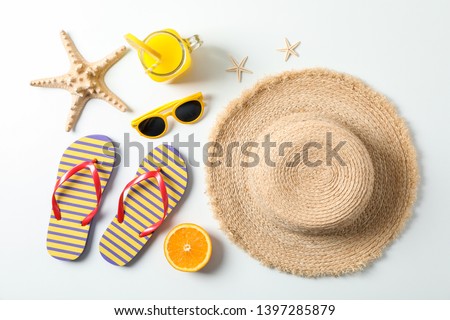 Flat lay composition with summer vacation accessories on white background,top view. Happy holidays