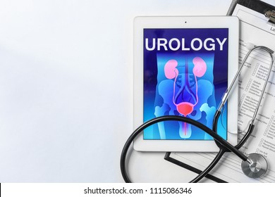 Flat Lay Composition With Tablet, Stethoscope And Test Form On Light Background. Urology Concept