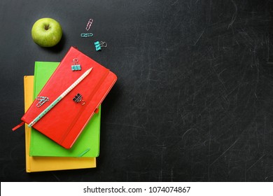 Flat lay composition for Teacher's day on chalkboard