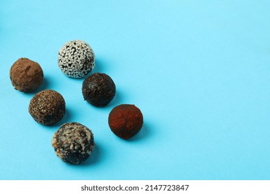 Flat Lay Composition With Truffles On Blue Background