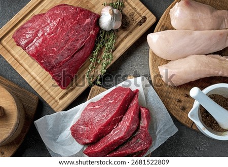 flat lay composition of various meat on black table, top view