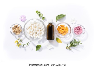 Flat lay composition of various vitamin capsules and dietary supplements isolated on white background. Vitamin complexes concept.