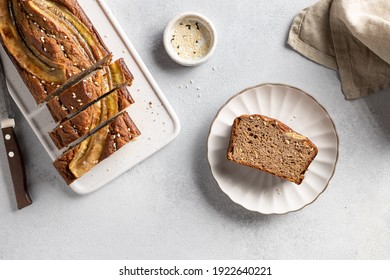 Flat Lay Composition With Vegan Buckwheat Banana Bread And Slice On White Plate. Healthy Vegan Food Concept.