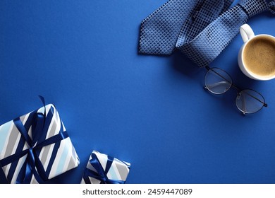 Flat lay composition with vintage gift boxes, coffee cup, necktie, glasses on dark blue background. Happy Fathers Day concept - Powered by Shutterstock