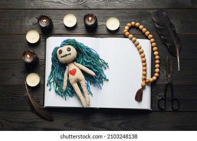 Flat Lay Composition With Voodoo Doll On Dark Wooden Table