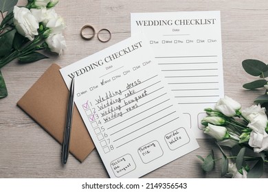 Flat lay composition with Wedding Checklists and planner on white wooden table - Powered by Shutterstock