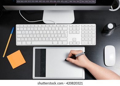 flat lay of computer and graphics tablet 
