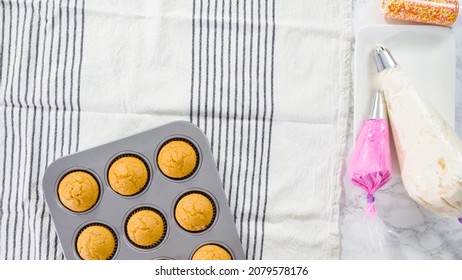 Flat Lay. Cooling Freshly Baked Pumpkin Spice Cupcake.