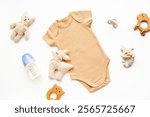 Flat lay with cotton baby cloth and milk bottle. Eco friendly newborn accessories, top view.