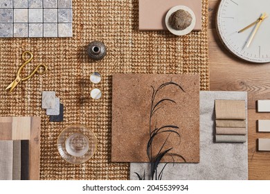 Flat lay of creative architect moodboard composition with samples of building, orange textile and natural materials and personal accessories. Top view, template.