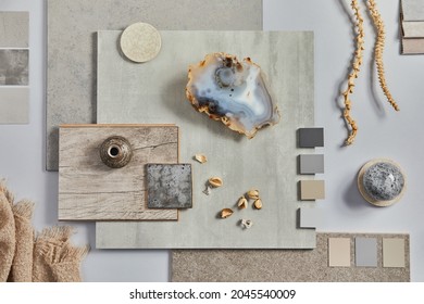 Flat lay of creative architect moodboard composition with samples of building, textile and natural materials and personal accessories. Top view, grey background, template. - Shutterstock ID 2045540009