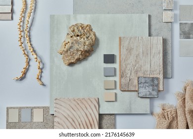Flat lay of creative architect moodboard composition with samples of building, textile and natural materials and personal accessories. Top view, grey background, template. - Shutterstock ID 2176145639