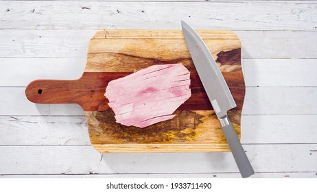 Flat Lay. Cutting Organic Honey Ham On A Wood Cutting Board.