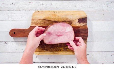 Flat Lay. Cutting Organic Honey Ham On A Wood Cutting Board.