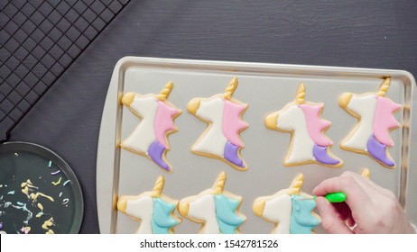 Flat Lay. Decorating Unicorn Sugar Cookies With Multi-color Royal Icing.