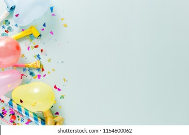 Flat lay decoration party concept on pastel blue background with copy space top view