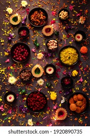 Flat Lay Of Diwali Food With Some Decor.