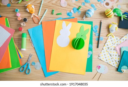 Flat Lay With DIY Paper Easter Bunnies And Colorful Paper, Easy Crafts For Kids.