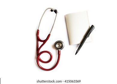 Flat Lay Of Doctor Desktop, Stethoscope, Notebook And Pen On White Background