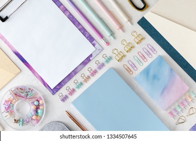 Flat Lay Of Education, Office Or School Stationery, Mockup Background On White Desk. Flatlay And Top View Of Pastel Female Office Tools, Pen And Ink