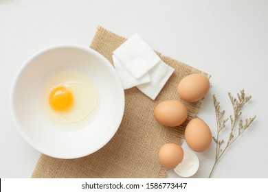 Flat Lay Of Egg White And Cotton Pad, Facial Mask For Acne Skin.