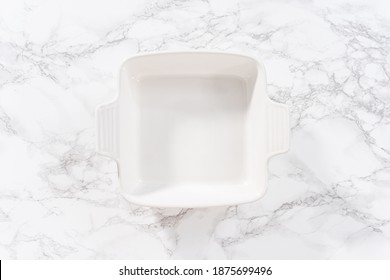 Flat Lay. Empty White Ceramic Baking Dish On A Kitchen Counter.