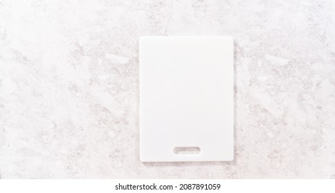 Flat Lay. Empty White Cutting Board On The Kitchen Counter.