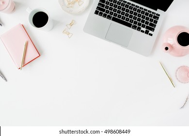 Flat lay fashion feminine home office workspace. Laptop, pink teapot, diary, golden pen and clips. Top view - Powered by Shutterstock