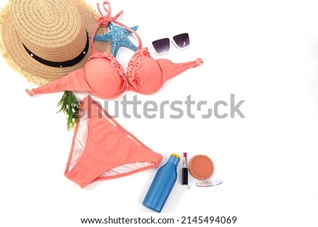 Flat lay of  fashion set on the beach in Summer holiday on the beaches with a red bikini on white background