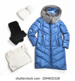 flat lay from female fashion winter outerwear for cold weather in winter season. Set winter women clothes isolated. Jacket, hat, trousers, jumper