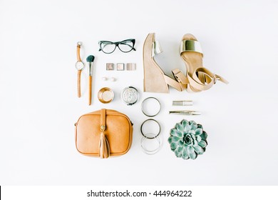 flat lay feminini accessories collage with purse, watch, glasses, bracelet, lipstick, sandals, mascara, brushes on white background.