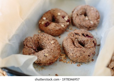 Flat Lay Four Bagels With Seeds On Top In Casserole Dish. Side Close Up View, Healthy Food Concept.