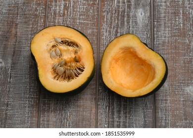 Flat Lay Of Fresh Acorn Squash On A Wooden Canvas.