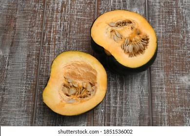 Flat Lay Of Fresh Acorn Squash On A Wooden Canvas.