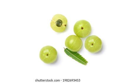 Flat lay of Fresh Amla (Indian gooseberry) fruits with leaf isolated on white background.