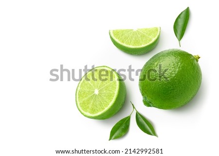 Flat lay of fresh lime with  cut in half and leaves isolated on white background.