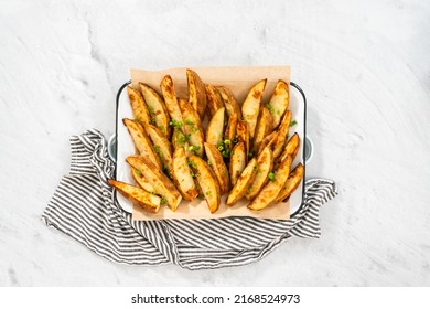 Flat Lay. Freshly Baked Potato Wedges With Spices On A White Serving Tray.