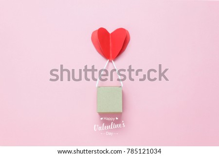 Flat lay image of decoration valentine's day background concept.Text sign of season with paper cut balloon love hang on beautiful pink sky with cloud.Several objects on pink wallpaper.pastel tone.