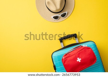 Flat lay image displaying summer travel essentials including a suitcase, hat, and sunglasses on a bright yellow background, evoking wanderlust and preparedness
