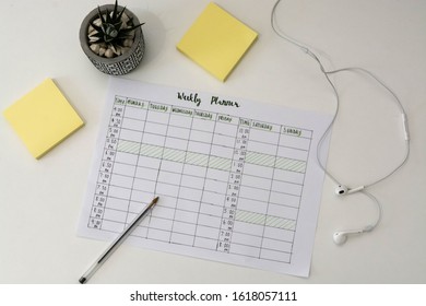 Flat Lay Image Of Weekly Planner With Stationary Scattered Around. Revision Timetable For Exams Or Activity Planner.