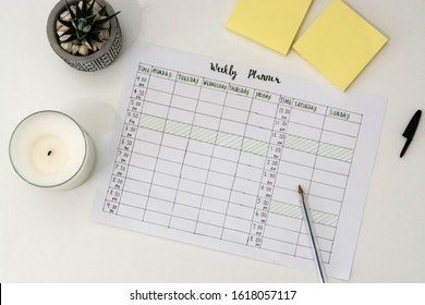 Flat Lay Image Of Weekly Planner With Stationary Scattered Around. Revision Timetable For Exams Or Activity Planner.