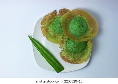 Flat lay Indonesia Traditional Cake, (Kue Ape) stacked on white plate and isolated on white backgroound. Selective focus cake ape