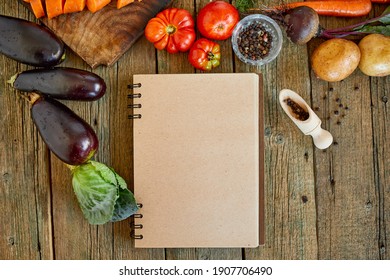 Flat lay of ingredient of cooking, vegetables around recipe book, grocering, local food, healthy clean eating, Vegetarian and vegan food, diet spring concept, top view, copy space.