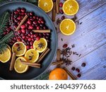 Flat lay ingredients to make home smell like Christmas with a homemade simmering Christmas potpourri for a Holiday textured background.	