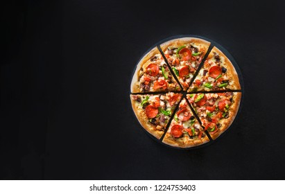 Flat Lay Of Italian Pizza On Dark Surface Top View