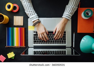 Flat Lay Of Laptop On Chalkboard Table. Background