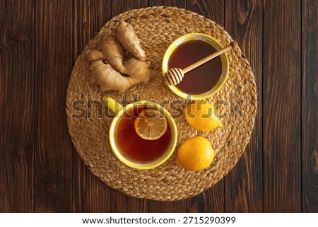 Flat Lay with Lemon Tea, Ginger and Honey on Wooden Table