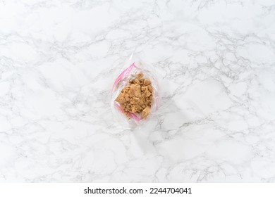 Flat lay. Light brown sugar on a marble counter top.