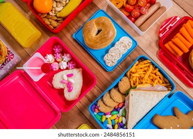 Flat lay Lunch box with various snack, fruit and sweet food on wooden table. Food Photography - Powered by Shutterstock