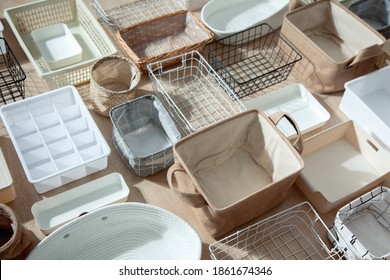 Flat Lay Of Marie Kondo's Storage Boxes, Containers And Baskets With Different Sizes And Shapes For Tidying Up Wardrobe. KonMari Method Organizer Boxes Set. Closet Organizing Concept.